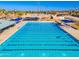 Large community lap pool with multiple lanes and shade structures at 7920 E Arlington Rd # 2, Scottsdale, AZ 85250