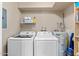 Convenient laundry room with washer, dryer, and extra shelving at 7920 E Arlington Rd # 2, Scottsdale, AZ 85250