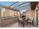 Relaxing patio with pergola, seating, and a built-in grill at 7920 E Arlington Rd # 2, Scottsdale, AZ 85250