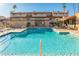 Community pool with plenty of lounge chairs and a spa at 7920 E Arlington Rd # 2, Scottsdale, AZ 85250