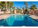 Community pool with surrounding patio and palm trees at 7920 E Arlington Rd # 2, Scottsdale, AZ 85250