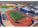 Aerial view of a high school campus with a football field and track at 7920 E Arlington Rd # 2, Scottsdale, AZ 85250