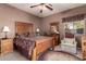 Bright bedroom with a wooden bed frame and ample natural light at 846 N Pueblo Dr # 104, Casa Grande, AZ 85122