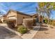 Attractive stucco home with 2-car garage, landscaping, and walkway at 846 N Pueblo Dr # 104, Casa Grande, AZ 85122