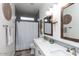 Modern bathroom with double vanity, gray tile, and decorative mirrors at 862 E Gemini Pl, Chandler, AZ 85249