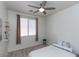 Well-lit bedroom featuring a ceiling fan and window coverings at 862 E Gemini Pl, Chandler, AZ 85249