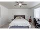 Bright bedroom with a queen-size bed and ceiling fan at 862 E Gemini Pl, Chandler, AZ 85249