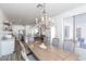 Open concept dining room features a wood table and chandelier at 862 E Gemini Pl, Chandler, AZ 85249