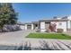 White house with gray garage doors and red flowers at 862 E Gemini Pl, Chandler, AZ 85249