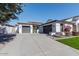 Two-story house with gray garage doors and landscaping at 862 E Gemini Pl, Chandler, AZ 85249