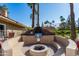 Outdoor BBQ area with fire pit and seating at 8787 E Mountain View Rd # 2101, Scottsdale, AZ 85258