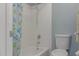 Bathroom with a shower/tub combo and fish-themed shower curtain at 8787 E Mountain View Rd # 2101, Scottsdale, AZ 85258