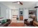 Open living room featuring leather armchairs, a view into the bedroom, and a dining area at 8787 E Mountain View Rd # 2101, Scottsdale, AZ 85258