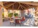 Community patio with table and chairs for outdoor dining at 8787 E Mountain View Rd # 2101, Scottsdale, AZ 85258