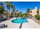 Community pool and spa surrounded by landscaping at 8787 E Mountain View Rd # 2101, Scottsdale, AZ 85258