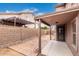 Private backyard with covered patio and block wall at 8802 E University Dr # 66, Mesa, AZ 85207