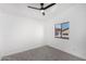 Well-lit bedroom with a ceiling fan and window at 8802 E University Dr # 66, Mesa, AZ 85207