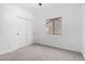 Well-lit bedroom with window and sliding door closet at 8802 E University Dr # 66, Mesa, AZ 85207