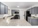 Spacious kitchen featuring gray cabinets and granite countertops at 8802 E University Dr # 66, Mesa, AZ 85207