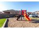 Community playground with a slide and climbing structure at 8802 E University Dr # 66, Mesa, AZ 85207