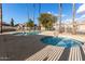 Community pool and spa with palm trees and surrounding homes at 8802 E University Dr # 66, Mesa, AZ 85207