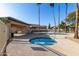 Community pool and spa with a covered patio and seating area at 8802 E University Dr # 66, Mesa, AZ 85207