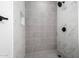 Modern shower with gray tile, marble, and hexagon floor tile at 8802 E University Dr # 66, Mesa, AZ 85207