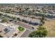 Aerial view of a single-Gathering home with a well-manicured lawn and neighborhood at 8833 W Tierra Buena Ln, Peoria, AZ 85382