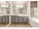 Double vanity bathroom with modern gray cabinets at 8833 W Tierra Buena Ln, Peoria, AZ 85382