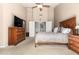 Spacious bedroom with a large bed and dresser at 8833 W Tierra Buena Ln, Peoria, AZ 85382