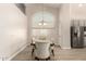 Elegant dining room featuring hardwood floors and stylish chairs at 8833 W Tierra Buena Ln, Peoria, AZ 85382