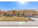 Tan house with a two-car garage and front yard at 8833 W Tierra Buena Ln, Peoria, AZ 85382