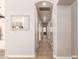 Bright hallway with wood-look floors and a decorative mirror at 8833 W Tierra Buena Ln, Peoria, AZ 85382