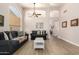 Bright living room with hardwood floors and comfy seating at 8833 W Tierra Buena Ln, Peoria, AZ 85382