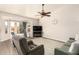 Living room with hardwood floors, ceiling fan, and patio access at 8833 W Tierra Buena Ln, Peoria, AZ 85382