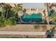 An aerial view of a freeform pool with rocks and a covered patio at 8833 W Tierra Buena Ln, Peoria, AZ 85382