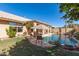 Relaxing pool area with grassy lawn and covered patio at 8833 W Tierra Buena Ln, Peoria, AZ 85382