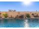 Stunning pool with a waterfall feature and decorative wall at 8833 W Tierra Buena Ln, Peoria, AZ 85382