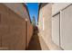 Narrow side yard with concrete pathway between block walls at 8833 W Tierra Buena Ln, Peoria, AZ 85382