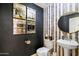 Stylish powder room with black and gold accents at 8915 N Invergordon Rd, Paradise Valley, AZ 85253