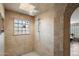 Elegant bathroom with a walk-in shower and glass block window at 8915 N Invergordon Rd, Paradise Valley, AZ 85253