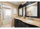 Bathroom with double vanity and a view into the shower at 8915 N Invergordon Rd, Paradise Valley, AZ 85253