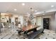 Open dining area features a rustic farmhouse table with bench seating at 8915 N Invergordon Rd, Paradise Valley, AZ 85253