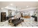 Elegant dining room with a large wooden table and chandelier at 8915 N Invergordon Rd, Paradise Valley, AZ 85253