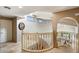 Upstairs hallway with a curved railing overlooking the living room at 8915 N Invergordon Rd, Paradise Valley, AZ 85253