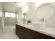 Modern bathroom with double vanity, soaking tub, and separate shower at 9439 E Palm Tree Dr, Scottsdale, AZ 85255