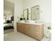 Elegant bathroom with double vanity and large mirrors at 9439 E Palm Tree Dr, Scottsdale, AZ 85255