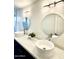 Bathroom with dual sinks, quartz countertops and modern lighting at 9439 E Palm Tree Dr, Scottsdale, AZ 85255