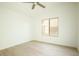 Simple bedroom with light flooring and a window at 9439 E Palm Tree Dr, Scottsdale, AZ 85255