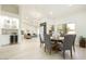 Bright dining room with modern table and chairs, adjacent to a kitchen and living area at 9439 E Palm Tree Dr, Scottsdale, AZ 85255